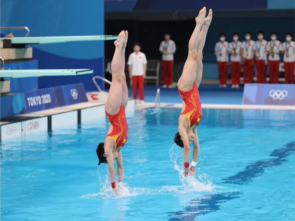 中国跳水队在首日的比赛中，凭借精湛的技术